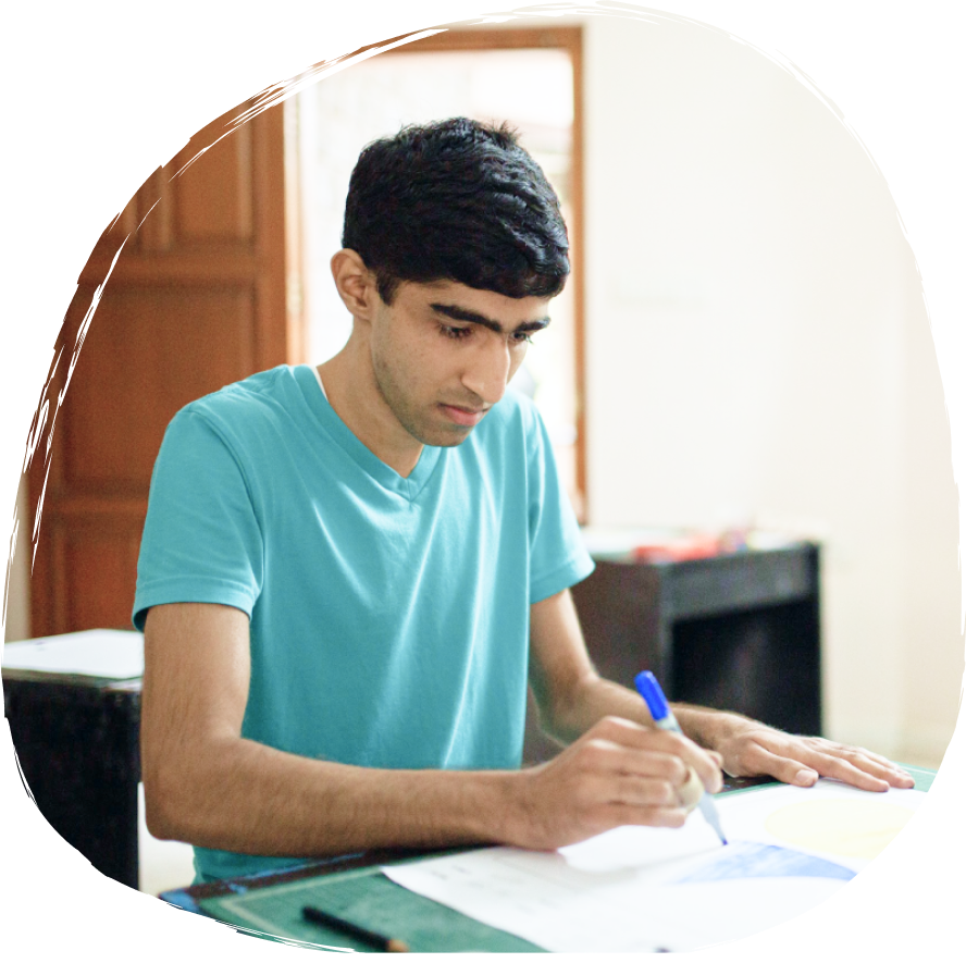 Student studying - SK operates under the aegis of Ayathi Trust